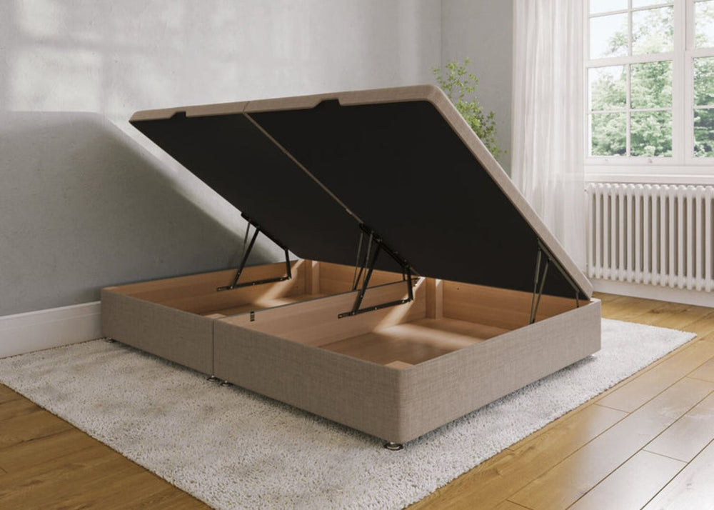 Sand bed frame with open gas lift storage compartment in a room with wooden floor