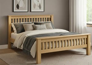 Amsterdam solid oak bed with slatted headboard and footboard, dressed with neutral bedding.