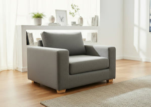 Angled view of Endura Armchair finished in Dandy Grey fabric