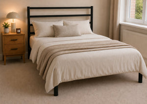 Becky metal bed frame with a slatted headboard and reinforced mesh base.