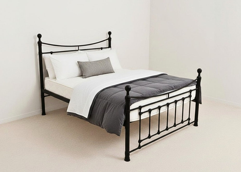 Black Calthorpe metal bed frame with decorative headboard, footboard, and reinforced mesh base.