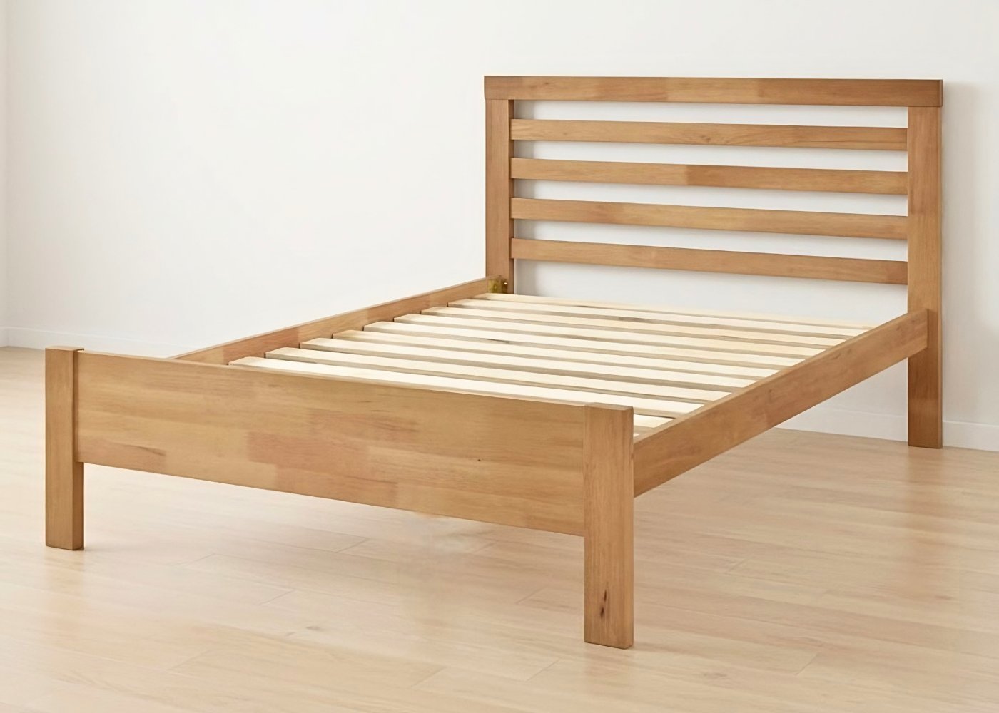 Cawston Bed: Scandinavian-style rubberwood bed frame with slatted headboard and solid slats in a warm oak finish.