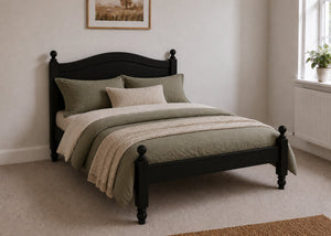 Dusseldorf Pine Bed frame with a natural finish, curved headboard, turned posts, and solid wooden slats in black stain.