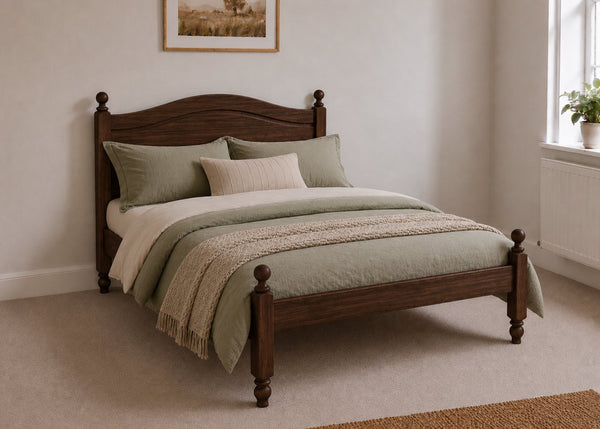 Dusseldorf Pine Bed frame with a natural finish, curved headboard, turned posts, and solid wooden slats in chocolate stain.