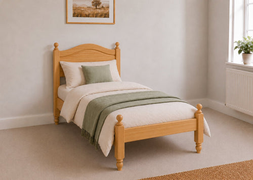 Dusseldorf Pine Bed frame with a natural finish, curved headboard, turned posts, and solid wooden slats in antique stain and single size.