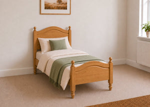 Dusseldorf solid pine bed frame with curved headboard and footboard, in oak stain single size.