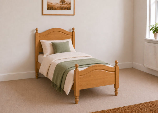 Dusseldorf solid pine bed frame with curved headboard and footboard, in oak stain single size.