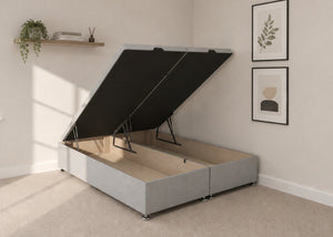 Light grey fabric end lift ottoman bed with open storage base and reinforced gas pistons.