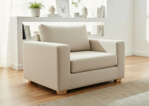 Angled view of Endura Armchair finished in Natural Weave fabric