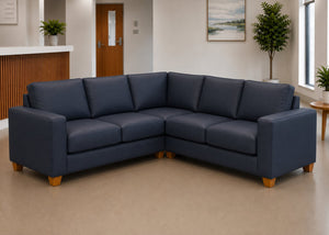 Endura Challenging Behaviour Sofa finished in Aston Navy Vinyl in a 2+2 configuration