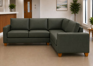 Endura Challenging Behaviour Sofa finished in Aston Bottle Green Vinyl in a 3+1 configuration