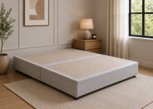Reinforced grey upholstered divan base with non-slip top and silver feet.