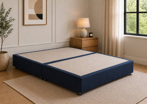Reinforced navy blue upholstered divan base with non-slip top and silver feet.