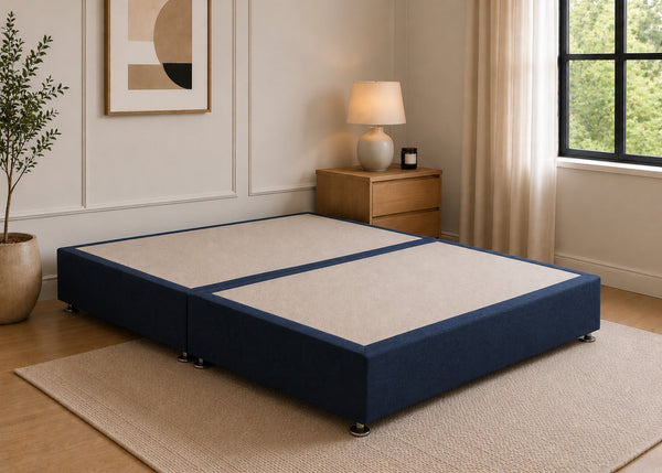 Reinforced navy blue upholstered divan base with non-slip top and silver feet.