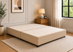 Reinforced sand upholstered divan base with non-slip top and silver feet.