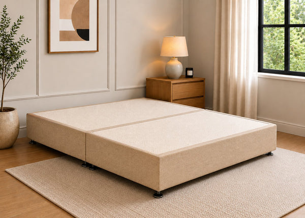 Reinforced sand upholstered divan base with non-slip top and silver feet.