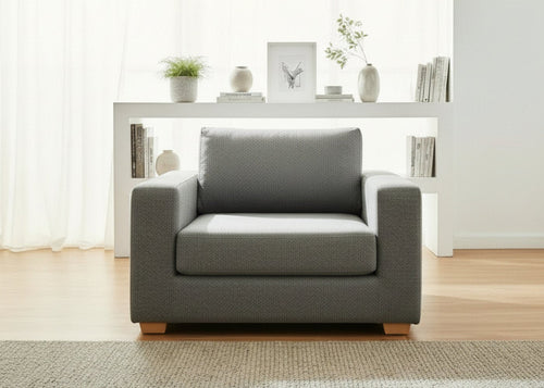 Endura Armchair finished in Dandy Grey fabric