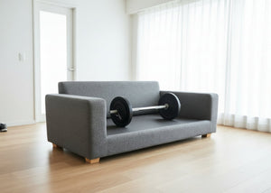 Grey sofa with no cushions with a barbell illustrating solid top