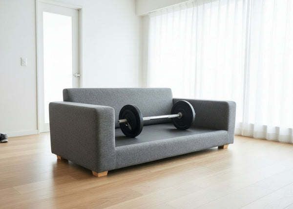 Grey sofa with no cushions with a barbell illustrating solid top
