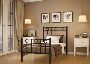 Neatly arranged bedroom with a bed, nightstands, and framed pictures on the wall.