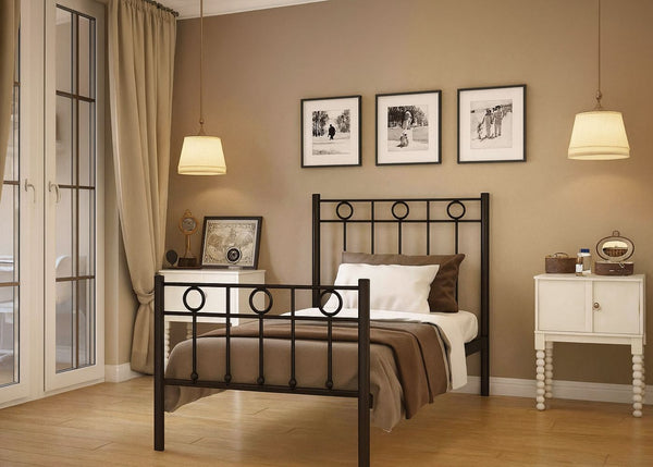Neatly arranged bedroom with a bed, nightstands, and framed pictures on the wall.