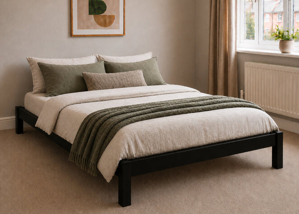 Lille pine wooden bed frame with solid slats in a minimalist design, in black stain.