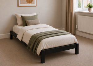 Lille pine wooden bed frame with solid slats in a minimalist design, in black stain single size.
