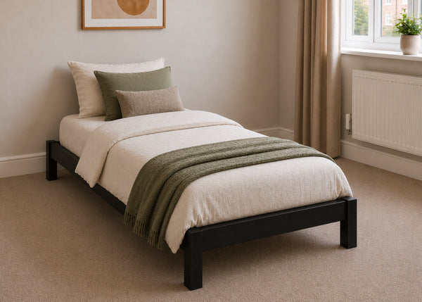 Lille pine wooden bed frame with solid slats in a minimalist design, in black stain single size.