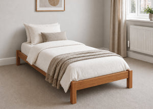 Lille pine wooden bed frame with solid slats in a minimalist design, in oak stain single size.