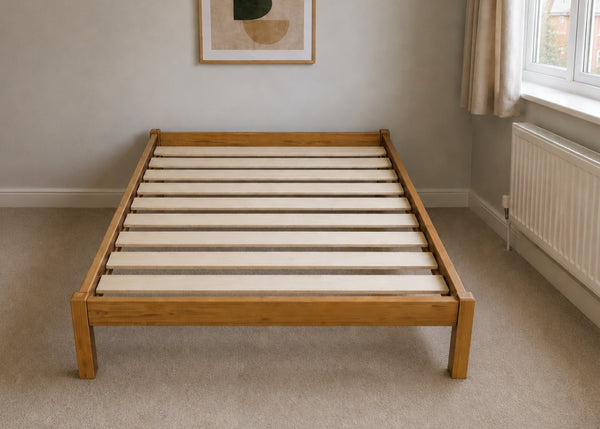 Lille Pine Bed: Low-profile natural pine wood bed frame with solid slats in a minimalist design.