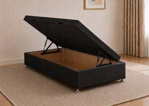 Single black fabric side lift ottoman bed with thick corner posts and reinforced storage base, open to show gas-assisted mechanism.
