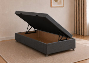 Single charcoal fabric side lift ottoman bed with thick corner posts and reinforced storage base, open to show gas-assisted mechanism.