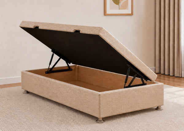 Single sand fabric side lift ottoman bed with thick corner posts and reinforced storage base, open to show gas-assisted mechanism.