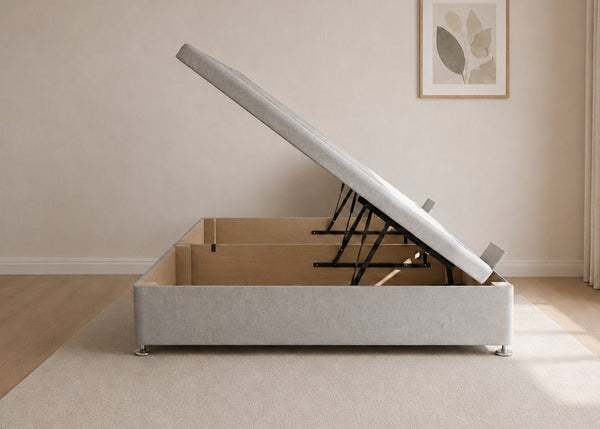 Light Grey fabric side lift ottoman bed with thick corner posts and reinforced storage base, open to show gas-assisted mechanism.