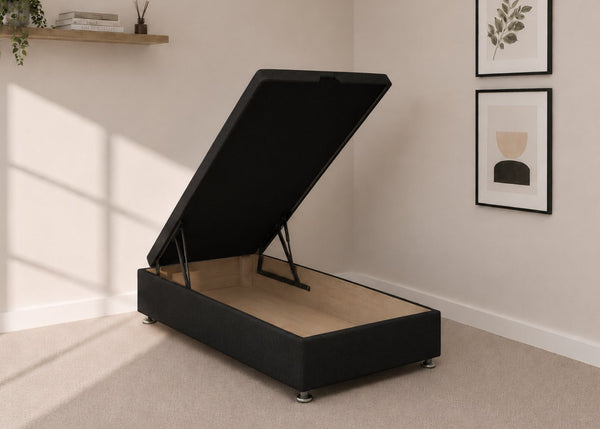 Single black fabric end lift ottoman bed with open storage base and reinforced gas pistons.