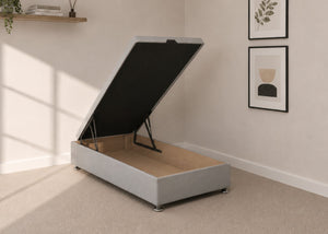 Single light grey fabric end lift ottoman bed with open storage base and reinforced gas pistons.