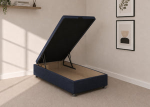 Single navy blue fabric end lift ottoman bed with open storage base and reinforced gas pistons.