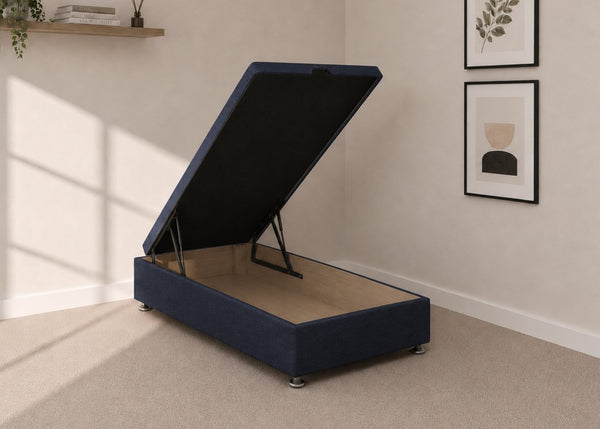 Single navy blue fabric end lift ottoman bed with open storage base and reinforced gas pistons.
