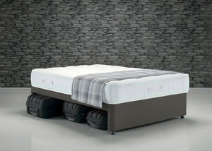 Single slate grey faux linen divan base with suitcase storage, non-slip top, and wheels.