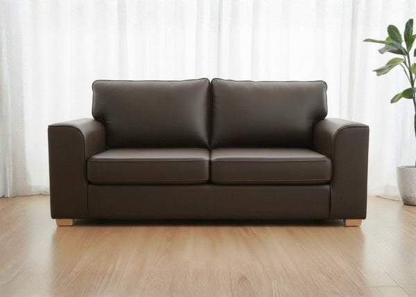 Titan sofa finished in Brown vinyl shown with light wood feet
