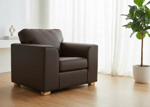 Titan Chair Finished in chocolate brown vinyl with light wood feet in a lifestyle angle