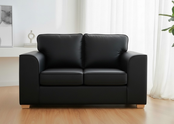 Titan Sofa finished in Black Vinyl with light wood feet