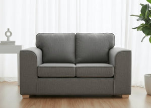 Titan Sofa finished in Dandy Grey Fabric with light wood feet
