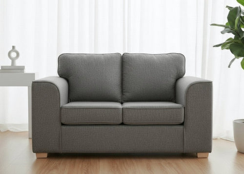 Titan Sofa finished in Dandy Grey Fabric with light wood feet