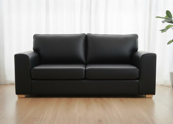 Titan sofa finished in Black vinyl shown with light wood feet
