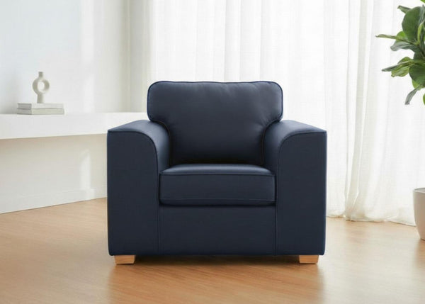 Titan Chair Finished in Blue vinyl with light wood feet