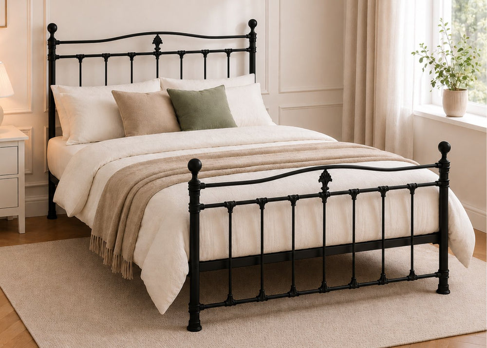 Black Tunstall metal bed frame with reinforced mesh base, thick steel, and decorative finials.