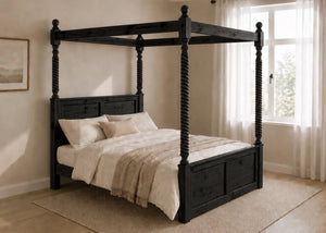 Warsaw Four Poster bed, natural wood finish, substantial corner posts, slatted base, and tall vertical posts in black.