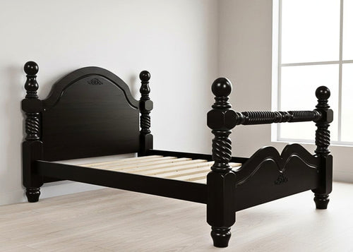 Black wooden bed frame with ornate turned posts, carved headboard, and solid slats.
