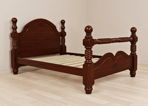 Warsaw Pine Bed, a solid timber bed frame with a warm wood finish, decorative turned posts, and supportive slats.